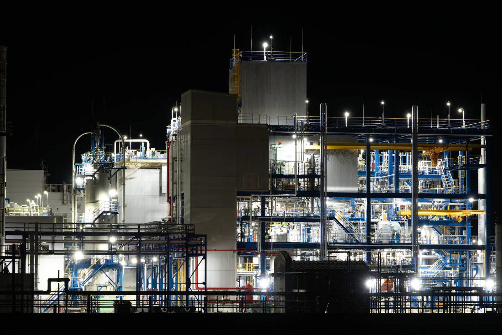 Chemical processing plant illuminated at night