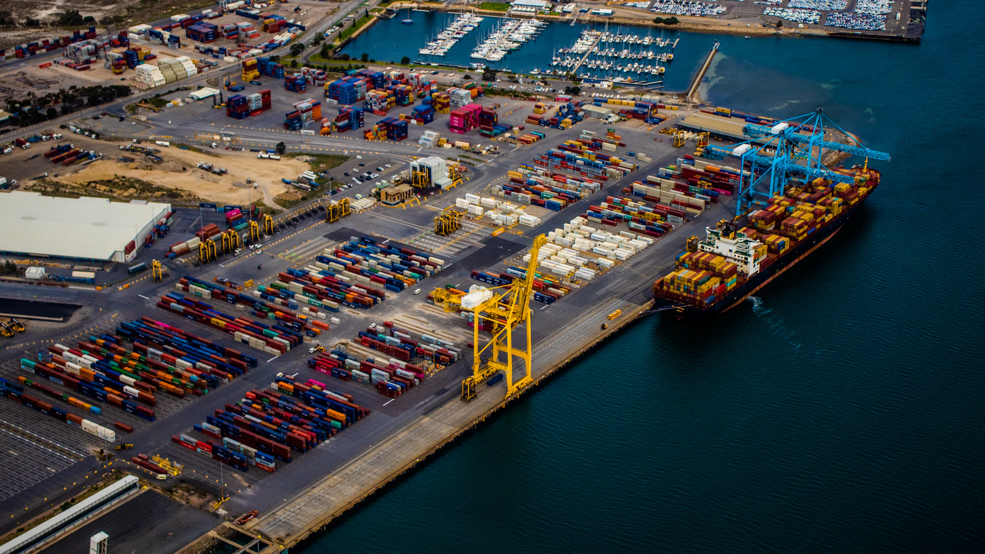 Aerial view of a container terminal with a ship alongside the quay